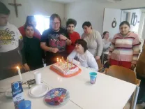 The group is celebrating a birthday.