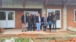 Group photo of the Noe Partium delegation in front of the shell construction.